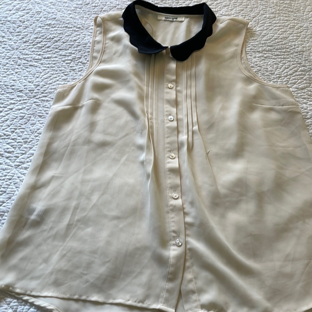 Sheer sleeveless button-down blouse